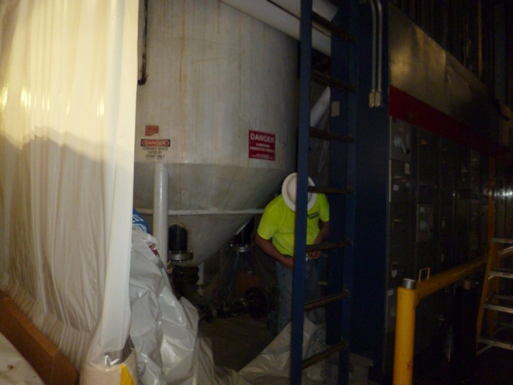 Enclosing asbestos before removal/